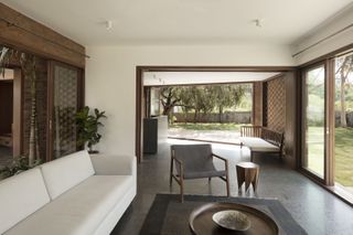 Brick House features a strong relationship between indoors and outdoors as displayed by its courtyards and large openings