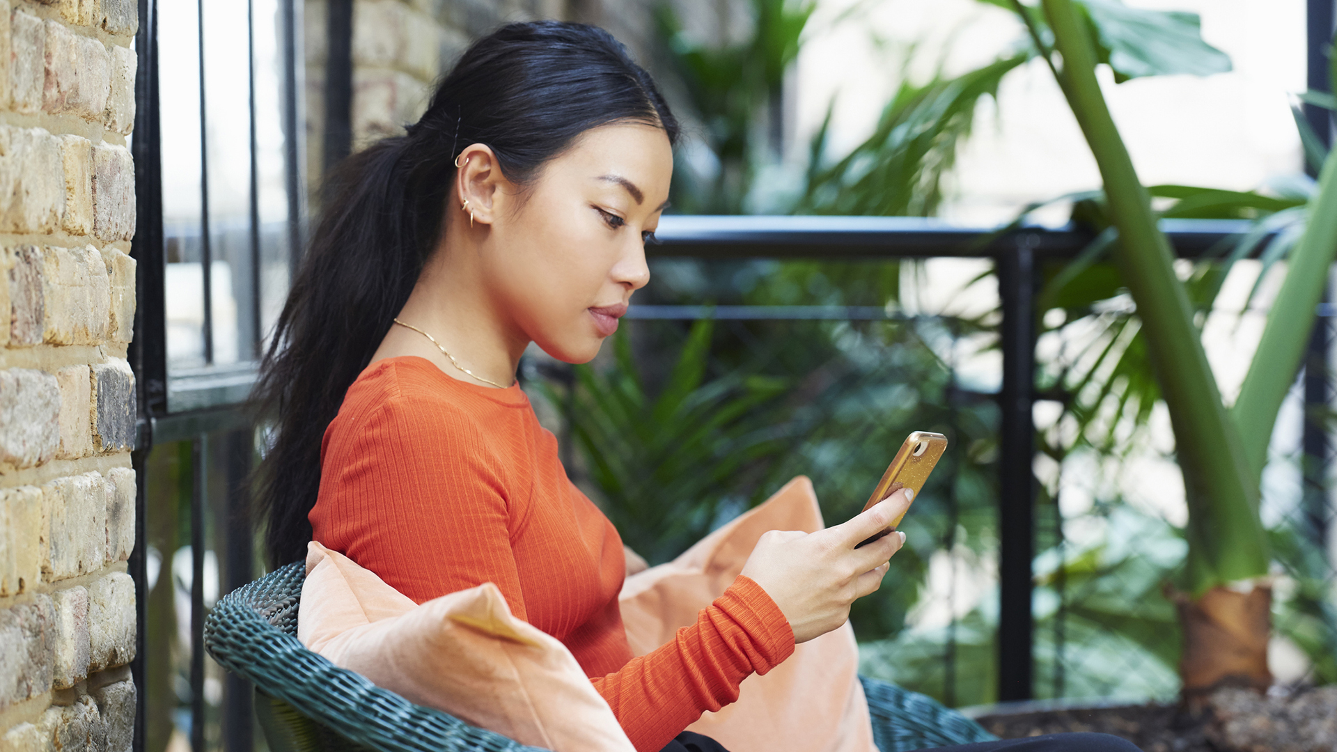 woman browsing email on her smartphone