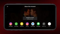 A phone displaying the new Netflix Moments interface, featuring a timestamp and social networking links