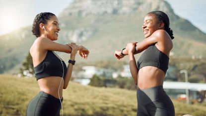 Two women performing an arm workout, one of the best tricep exercises 