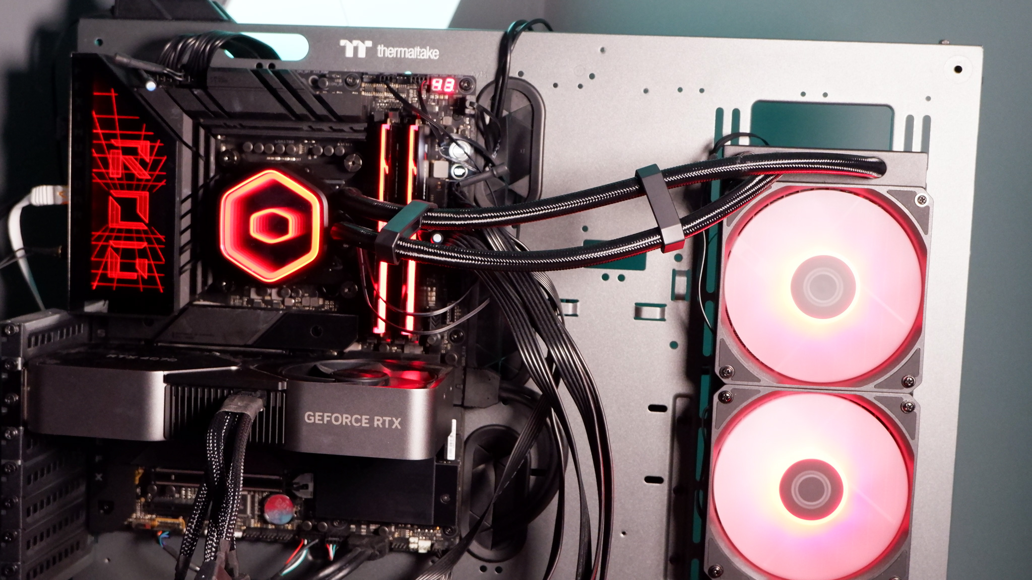 A Cooler Master MasterLiquid 360 Core II liquid cooler set-up on a test bench.