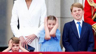 Prince Louis of Cambridge, Princess Charlotte of Cambridge and Prince George of Cambridge watch a flypast from the balcony of Buckingham Palace during Trooping the Colour on June 2, 2022 in London, England
