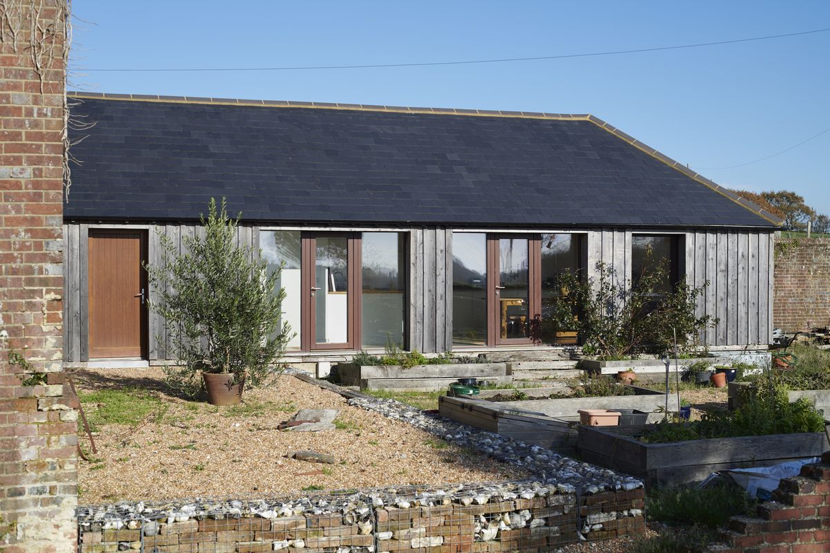 Larch cladding was chosen to cover the timber frame structure as it doesn&rsquo;t rot and it weathers from the original red to grey.