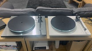 Rega Planar 3 and RS Edition side by side on a wooden rack