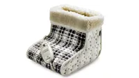 A Beurer branded cosy fleece and black checkered electric heated foot warmer