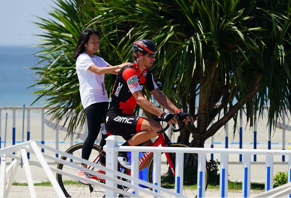 Daniel Oss provides some alternative transportation for a spectator at Tour of Guangxi