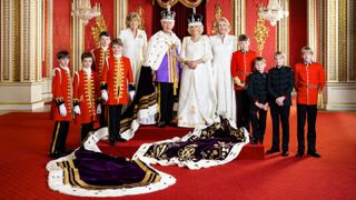 King Charles III and Queen Camilla with their Pages of Honour and Ladies in Attendance on the day of the coronation in the Throne Room at Buckingham Palace. Pictured (left to right) Ralph Tollemache, Lord Oliver Cholmondeley, Nicholas Barclay, Prince George of Wales, the Marchioness of Lansdowne, King Charles III, Queen Camilla, the Queen's sister Annabel Elliot, the Queen's grandson Freddy Parker Bowles, the Queen's great-nephew Arthur Elliot, and the Queen's grandsons Gus Lopes and Louis Lopes. The King is wearing the Imperial State Crown, and Robe on May 6, 2023 in London, England