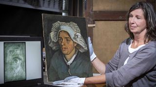 A woman holds a Van Gogh painting that contains a hidden portrait of the painter. 