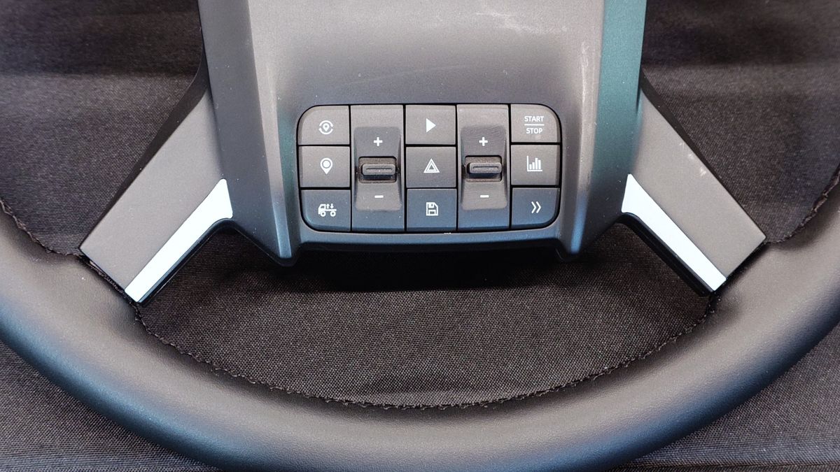 Close up photos of the new and unreleased PXN truck simulator wheel showing the design and controls.