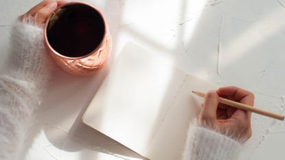 Woman filling in journal