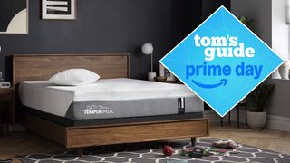 The Tempur-Pedic Tempur-Adapt mattress on a bed frame in a bedroom, a Tom's Guide Prime Day deals graphic in the top left corner
