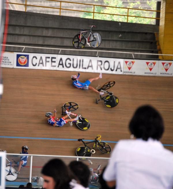 Bikes fly through the air after a crash in the women's omnium qualifier