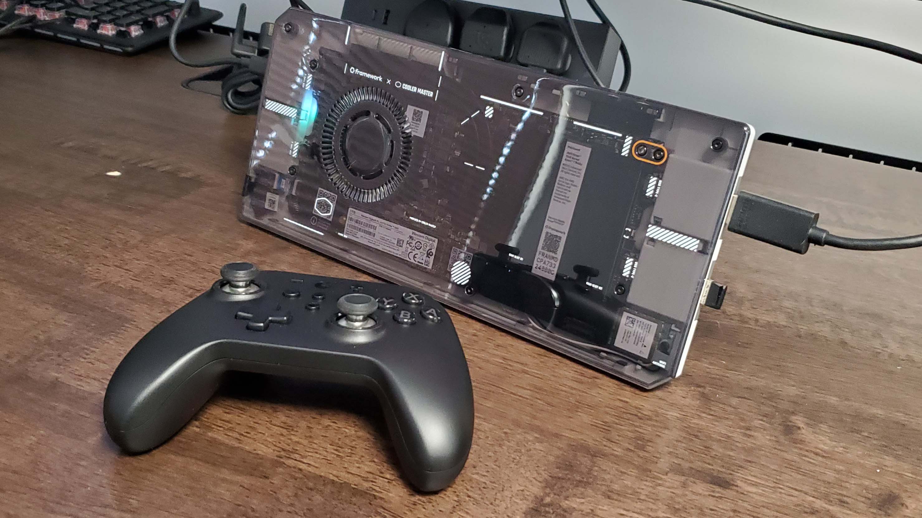 Framework AMD mainboard running in a Cooler Master chassis, with SteamOS on it