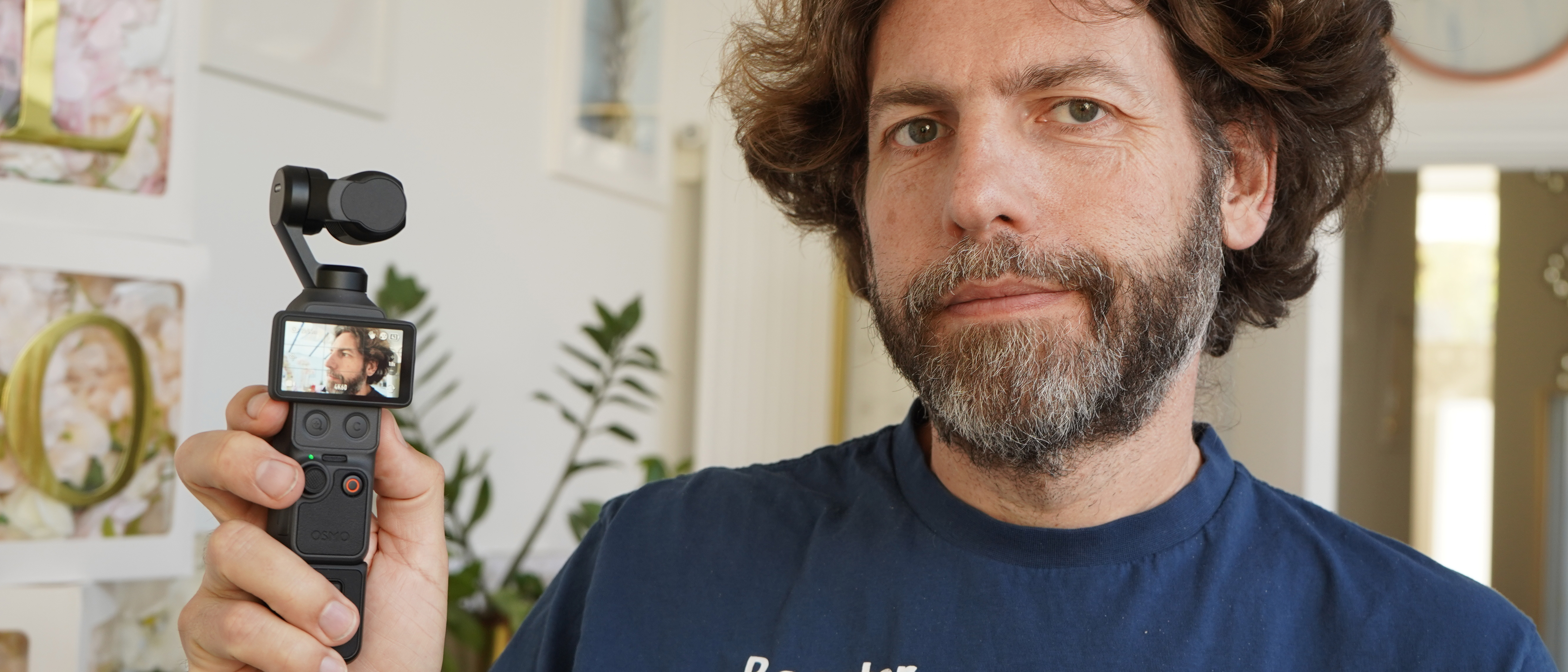 DJI Osmo Pocket 4 in Adam Juniper's hand