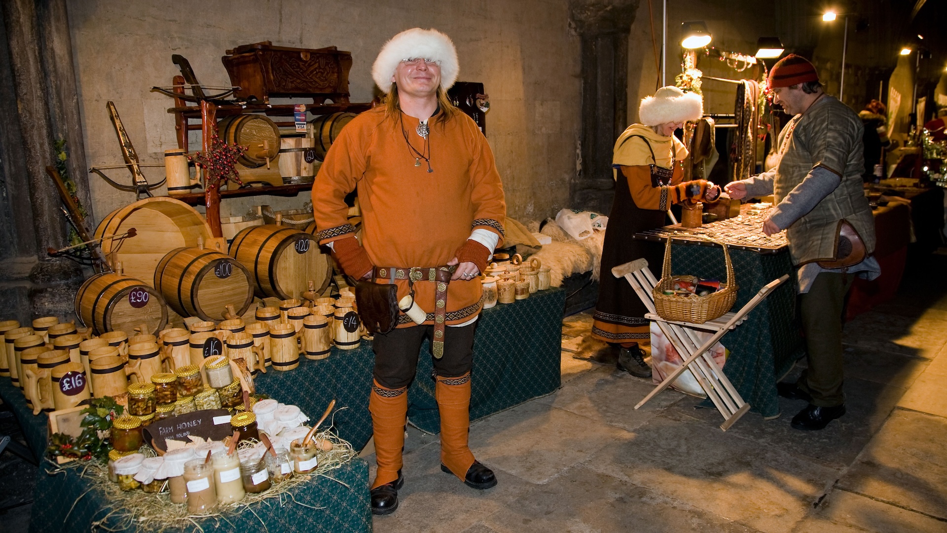 A man with a Viking-themed stall at a market