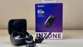 Sony InZone Buds on a desk with the packaging.