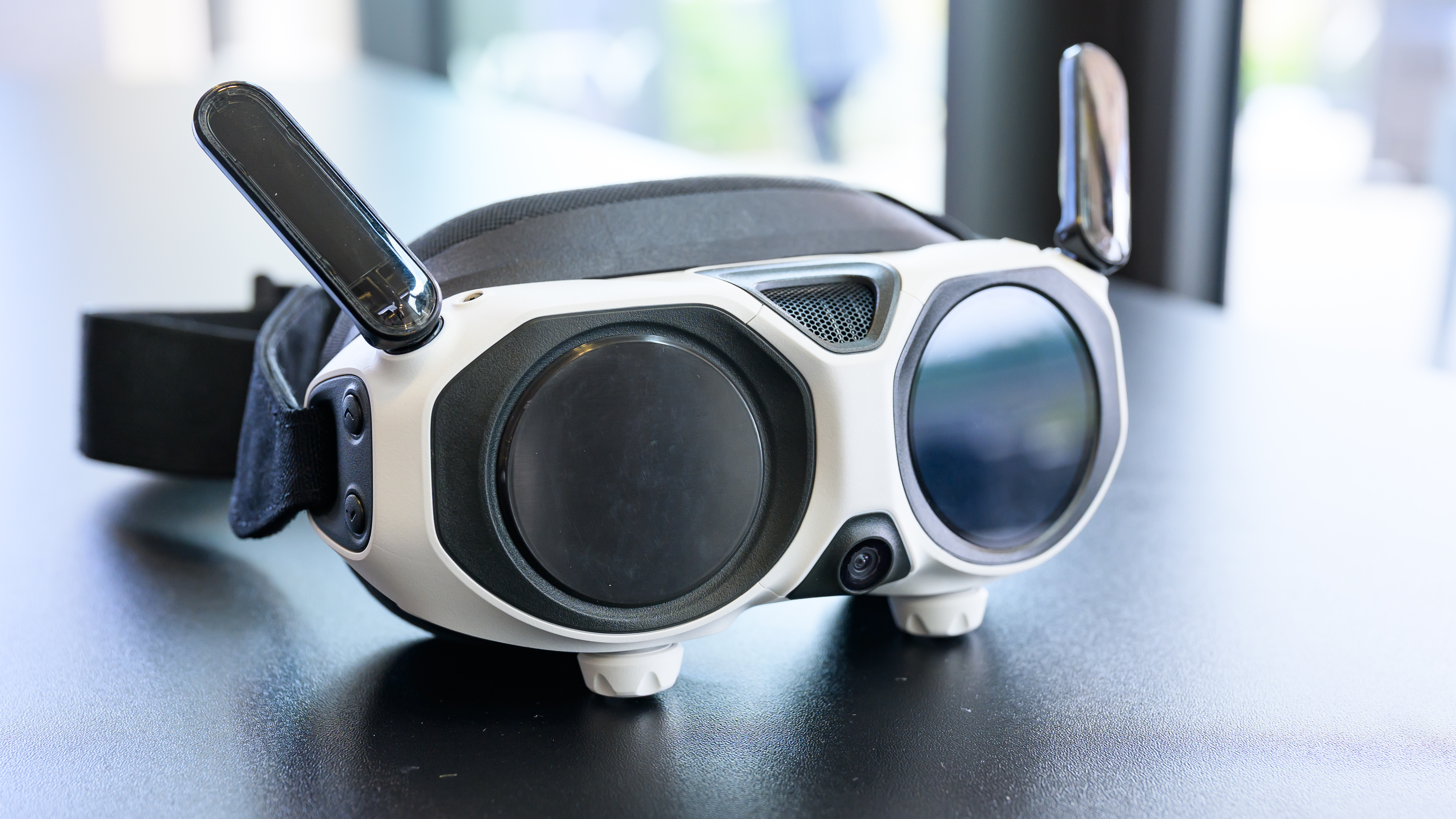 The Antigravity A1 goggles on a surface.