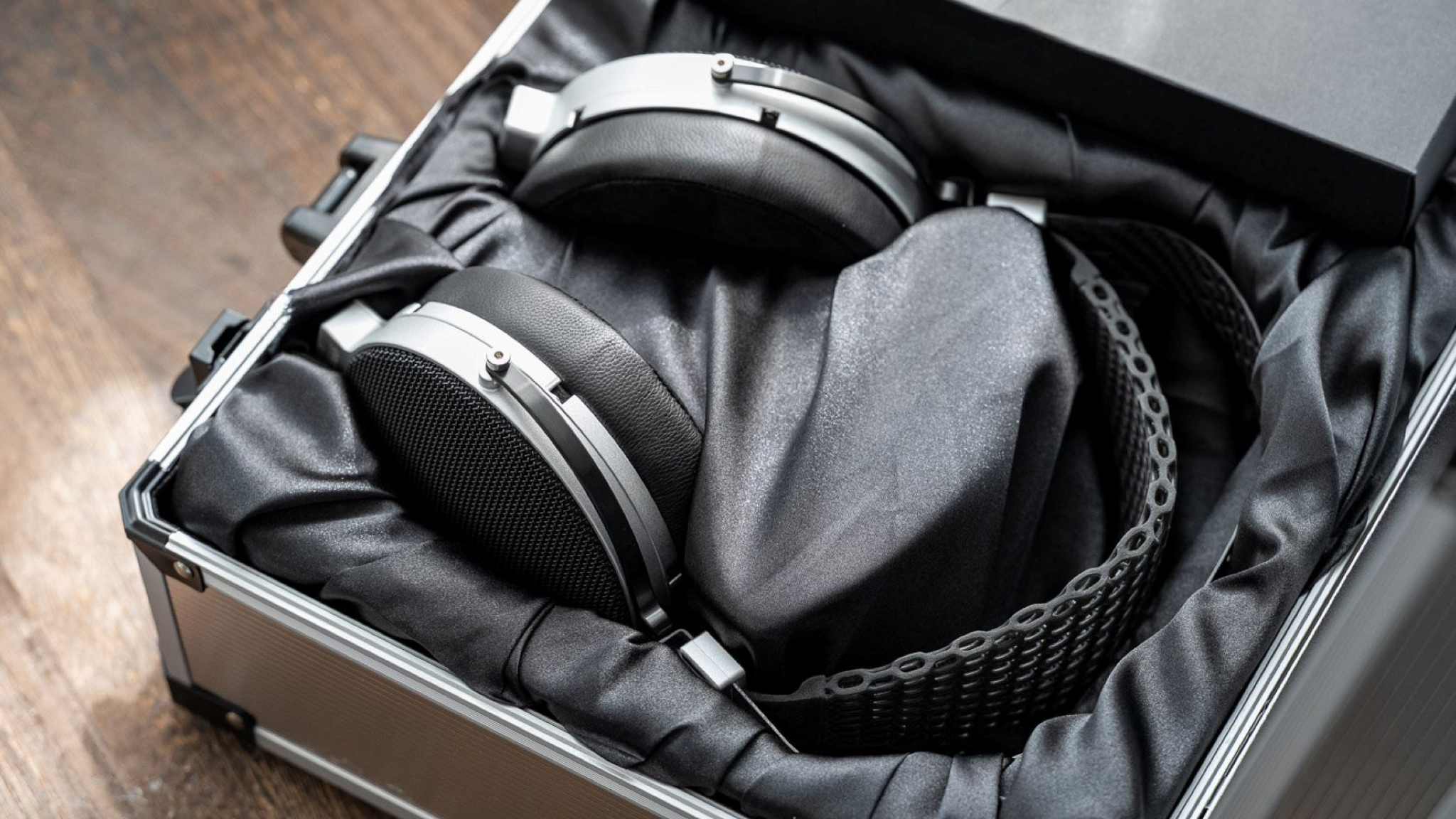 Moondrop Skyland headphones nestled inside their protective aluminium case