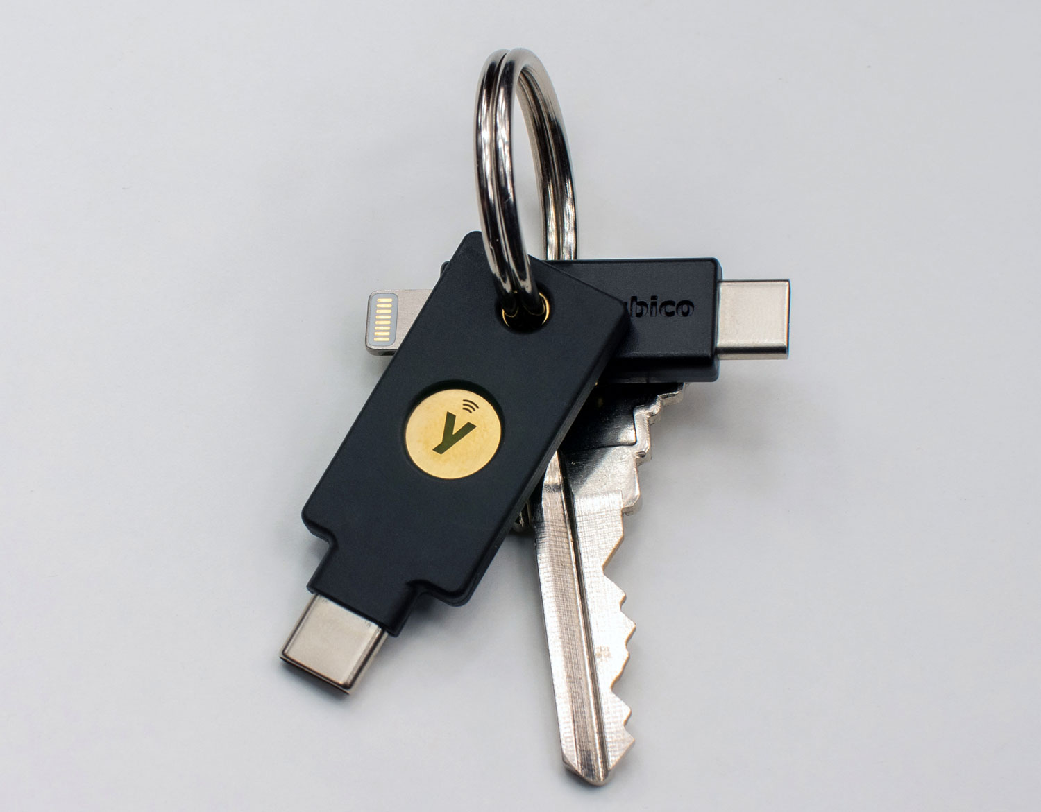 A YubiKey 5C NFC on a keychain with a YubiKey 5Ci.