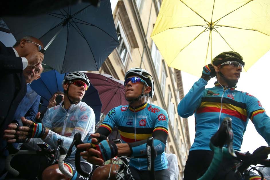 Philippe Gilbert and his Belgian teammates wrap up against the rain in 2013