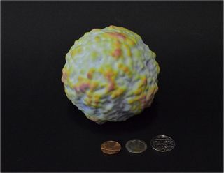 A 3D-printed model of the cosmic microwave background. The color and texture represent temperature and density.