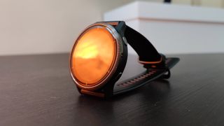 the light from a salt lamp reflected on the AMOLED screen of Garmin Venu 2
