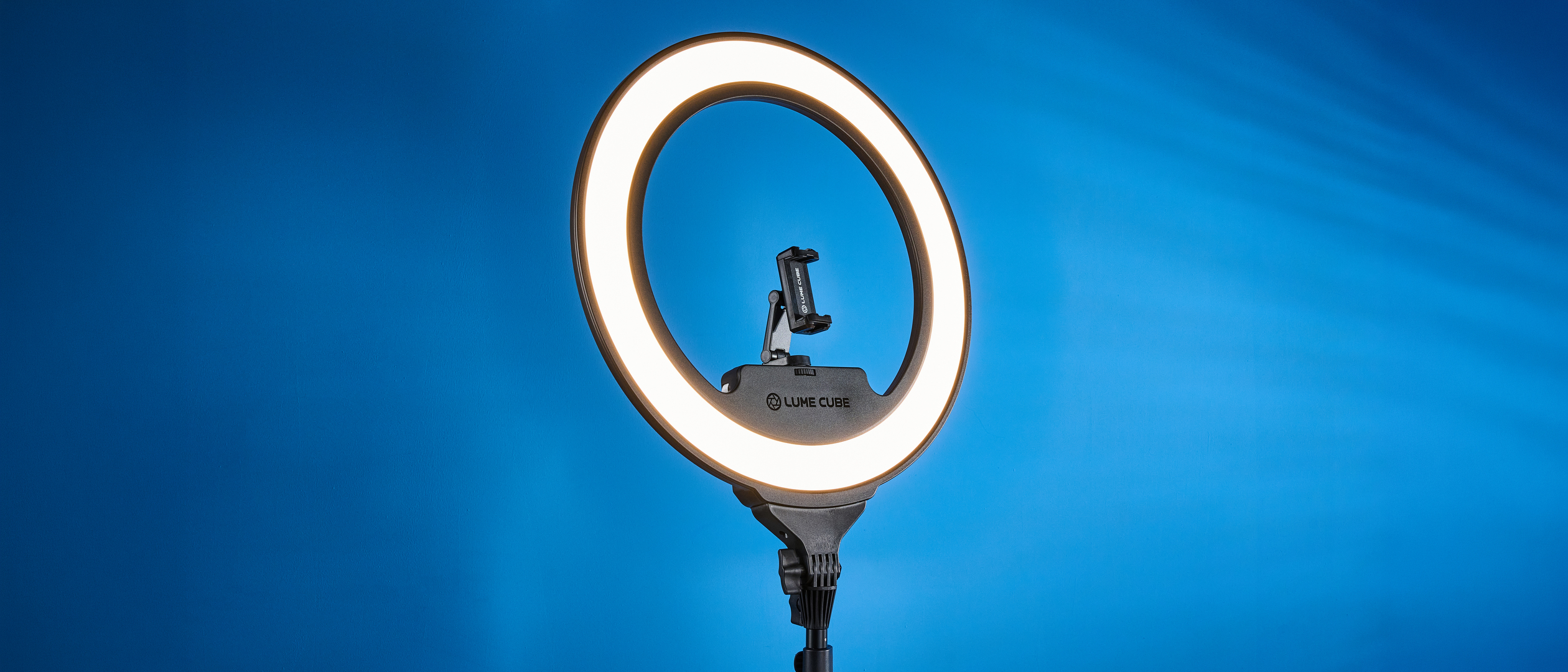 Lume Cube Cordless Ring Light Pro photographed in front of a blue background