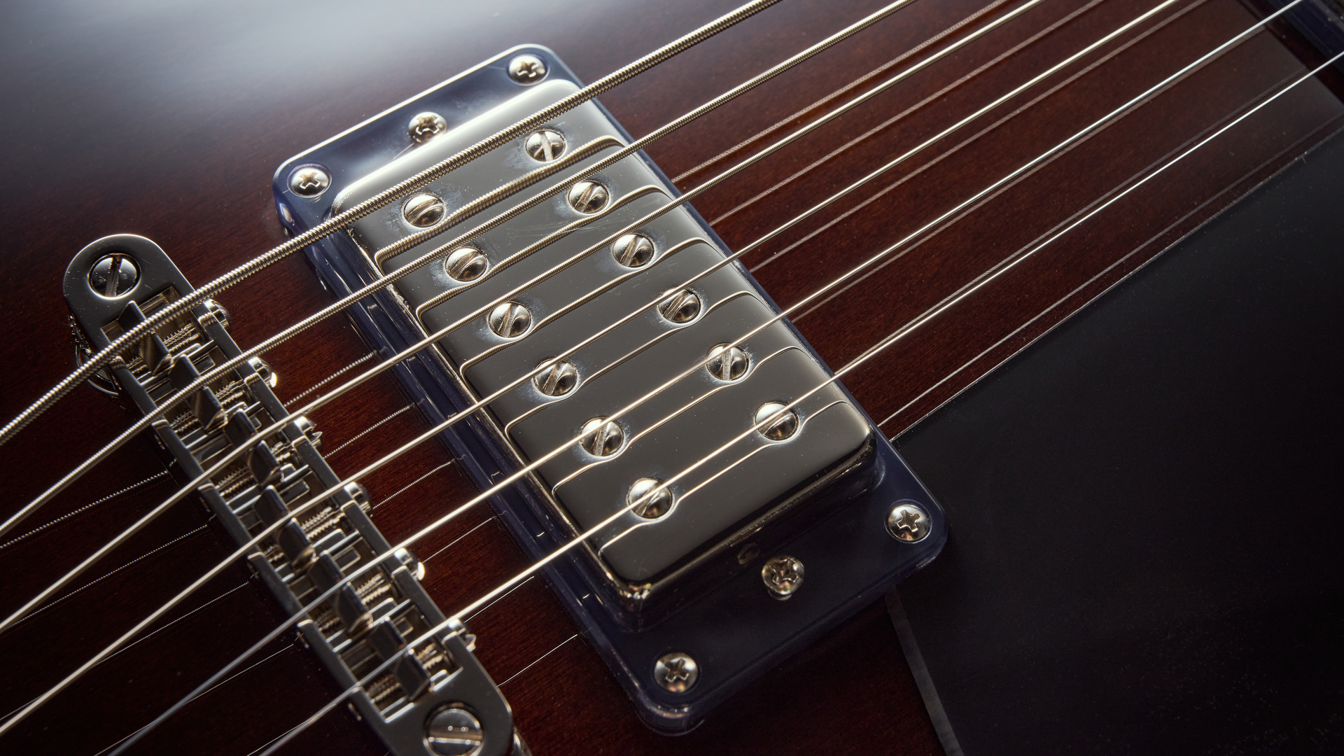 Close up of the neck humbucker on the Gretsch Electromatic Jet Baritone guitar