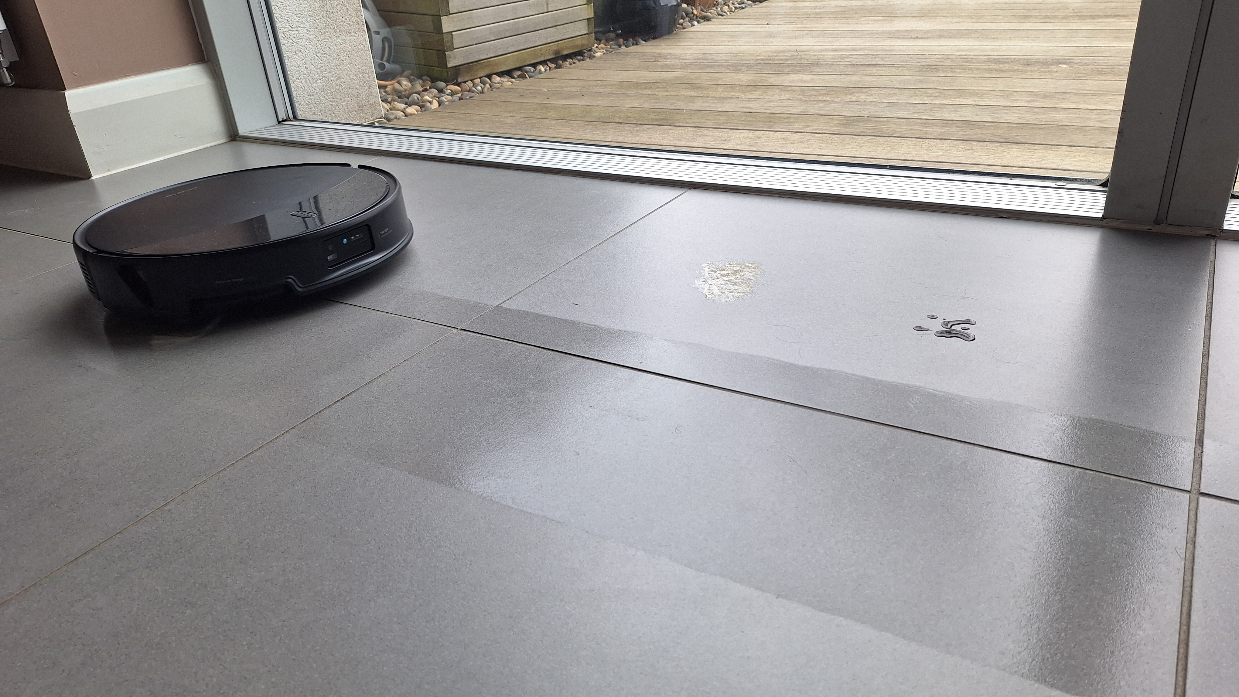 Roborock Saros 20 mopping a tiled floor