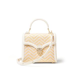 light yellow raffia bag with white trim and a top handle