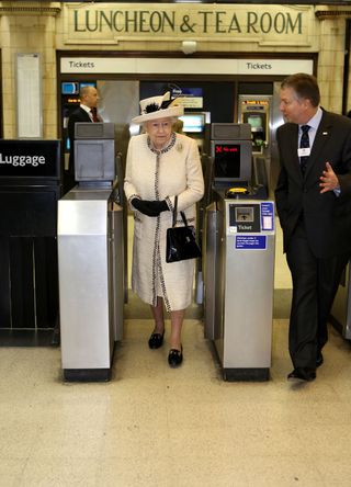 Queen Elizabeth II using the London Underground