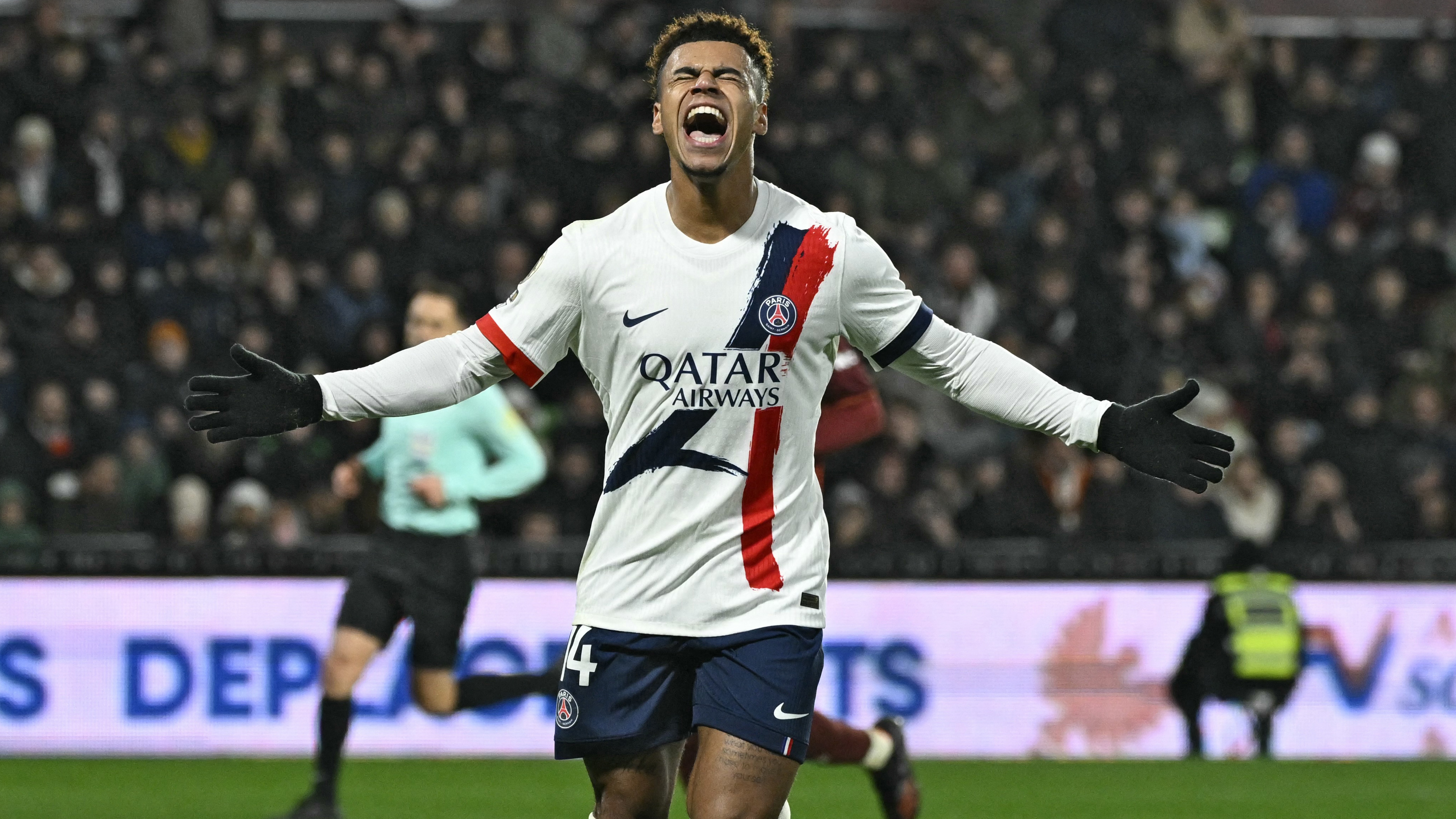Desire Doue celebrates after scoring a goal during the French L1 football match between Metz and Paris Saint-Germain. 