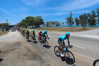 Astana at the head of the peloton during stage three to Kuala Terengganu