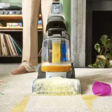VAX ONEPWR Compact Cordless Carpet Cleaner cleaning up spilled juice from carpets