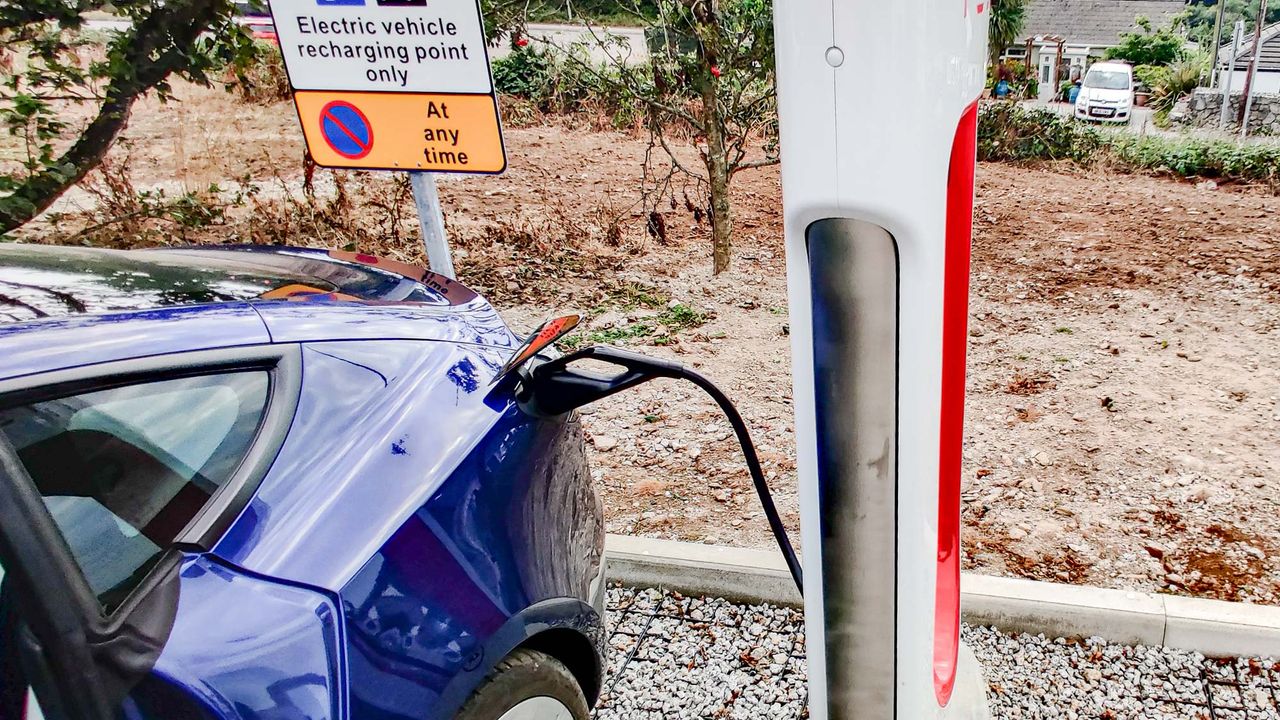 Tesla Model 3 charging at station