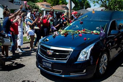 Thousands gathered for Muhammad Ali's funeral procession in Louisville, Kentucky.