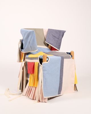 a chair with a cover made from fashion offcuts