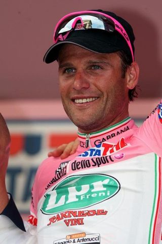 All smiles from Alessandro Petacchi (LPR Brakes-Farnese Vini) on the podium after his win in stage three of the Giro d'Italia, which gave him the leader's maglia rosa.