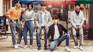 five teenagers pose in front of a ramshackle neighborhood, in the korean drama 'reply 1988'