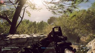 A screenshot from Battlefield 6, showing a sweeping vista behind some dense foliage