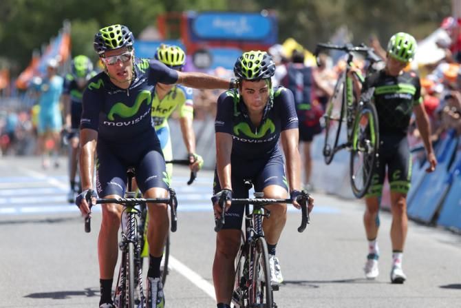 Movistar riders roll over the line after the crash