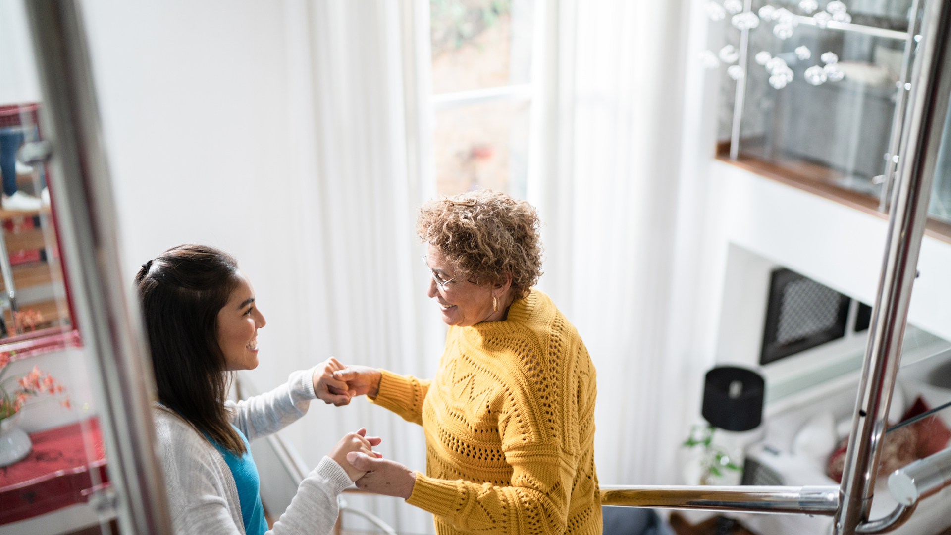 Image of two women talking on staircase