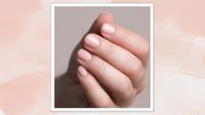 A close up of hand with a pale pink, glossy manicure/ in a pink watercolour paint-style template