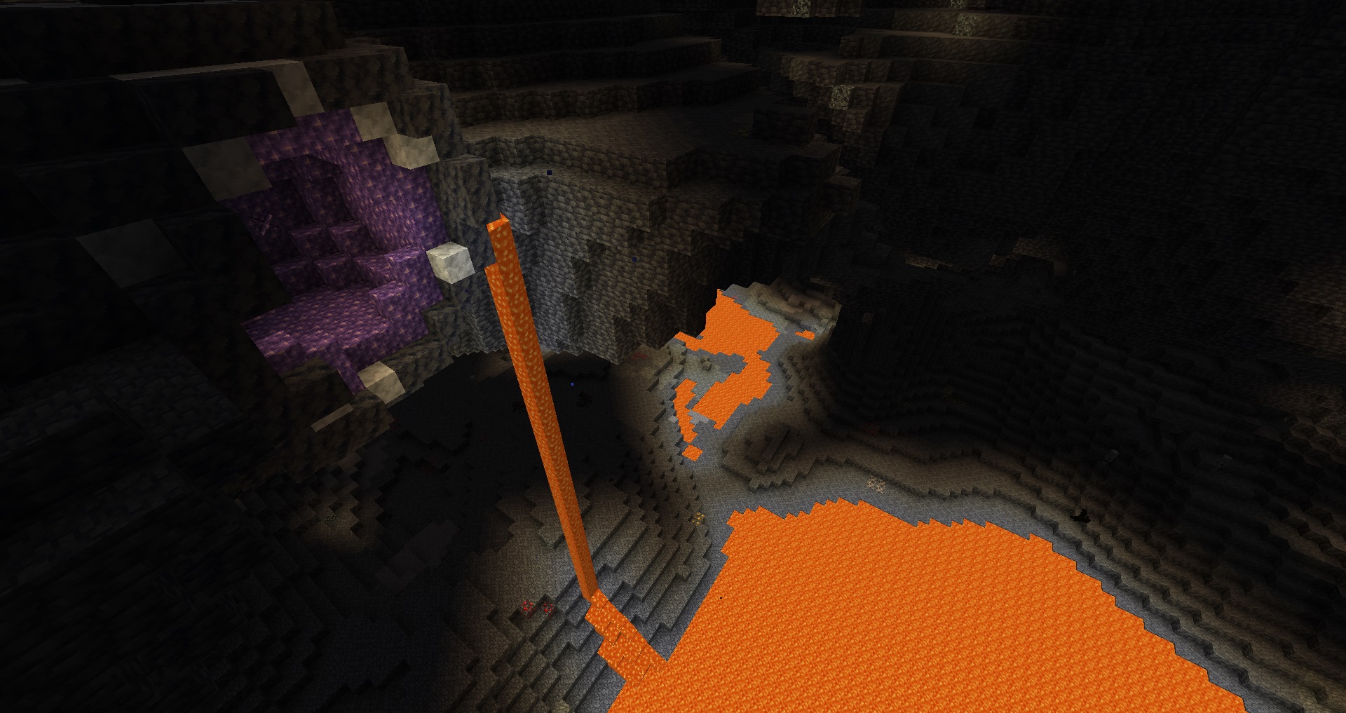 Minecraft - A large underground cave with an amethyst cluster and a lava waterfall going into a large open lava lake.