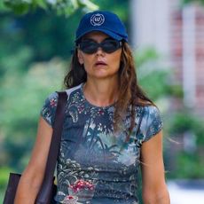 Katie Holmes walks on the Upper West Side wearing a Faithfull the Brand matching set with a leather tote bag and Gap baseball cap