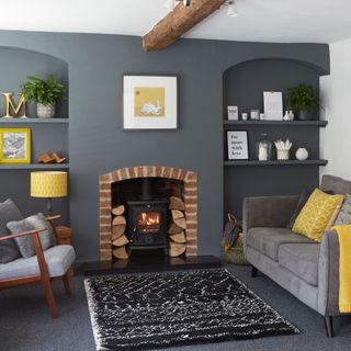 grey living room with fireplace and shelving