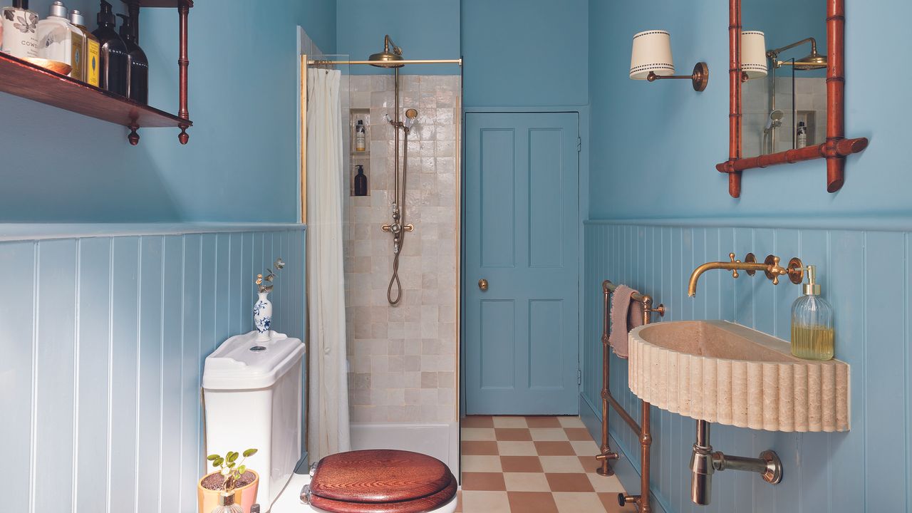 Blue bathroom with tiled cream shower