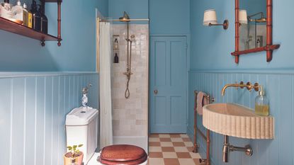 Blue bathroom with panelling and tiles