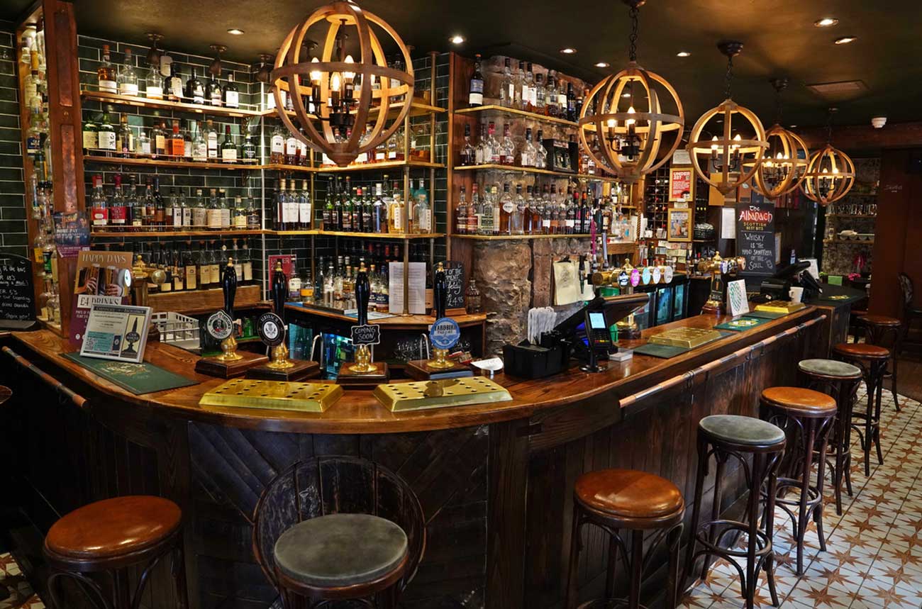 A wooden bar in the Albanach pub