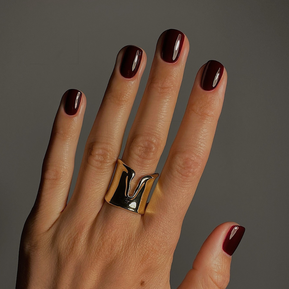 A dark red manicure by @matejanova